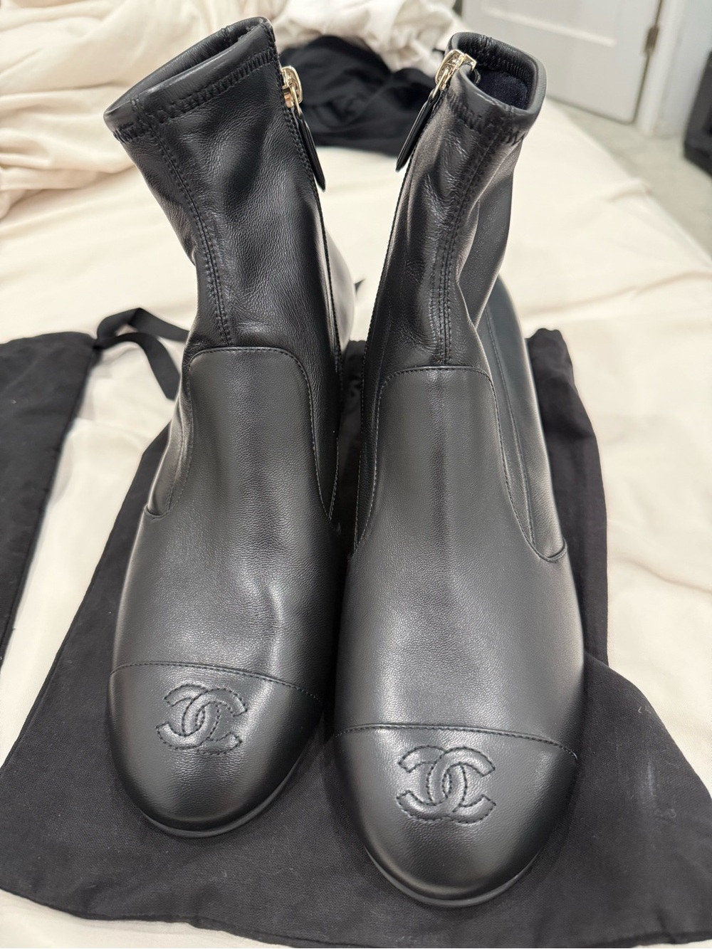 CHANEL Black Leather Ankle Booties with Embossed CC Cap